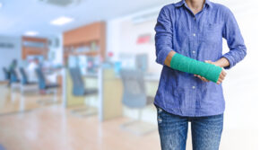 Woman with green arm cast